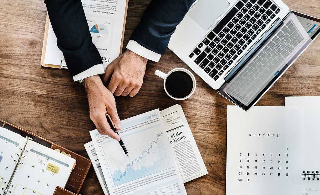 Business plan with financial charts and projections spread on a desk