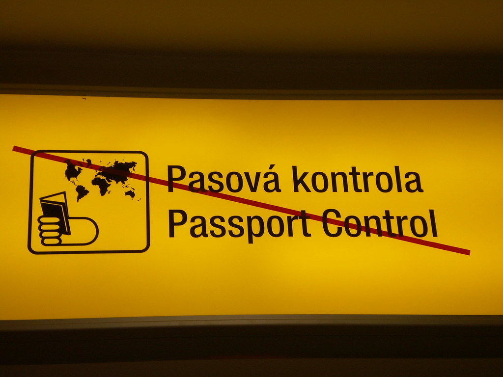 Passport and travel documents representing E-2 re-entry after travel