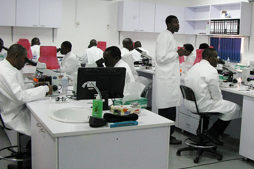Researchers in a lab who benefit from cap-exempt H-1B