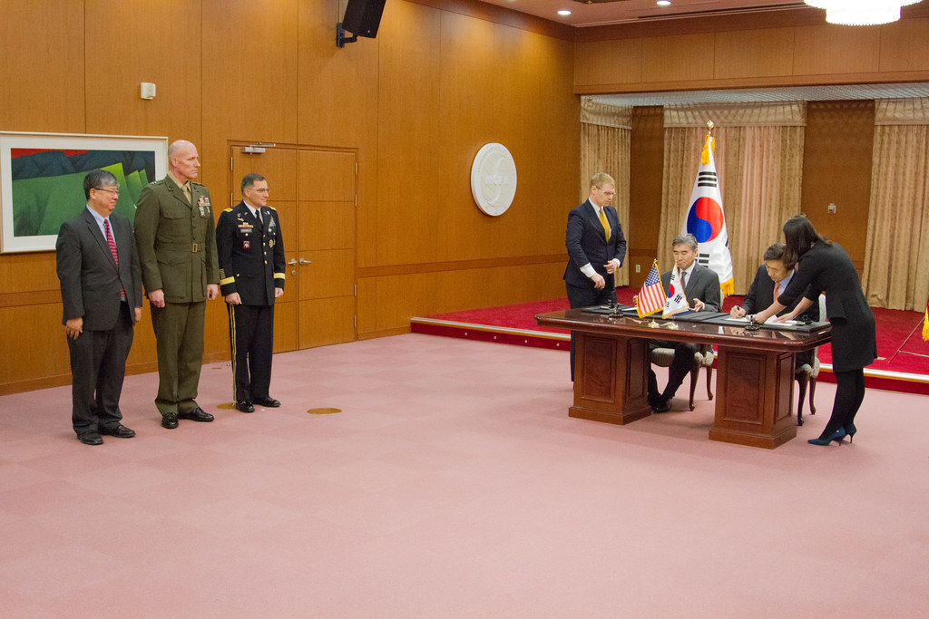 Signing a contract representing O-1 engagement agreements