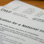 Office paperwork representing I-9 employment eligibility verification records