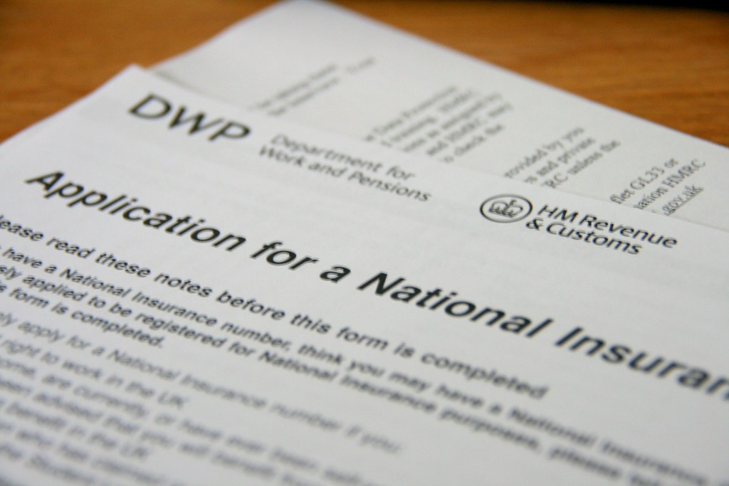 Office paperwork representing I-9 employment eligibility verification records