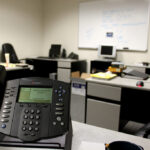 Office workstation representing H-1B sponsorship paperwork and compliance for employers