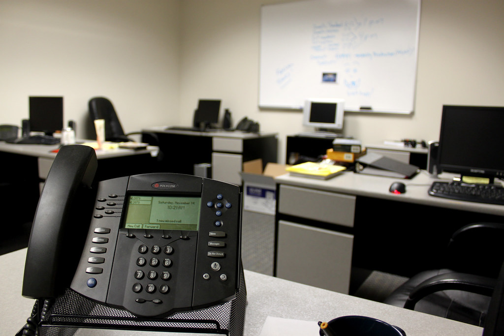 Office workstation representing H-1B sponsorship paperwork and compliance for employers