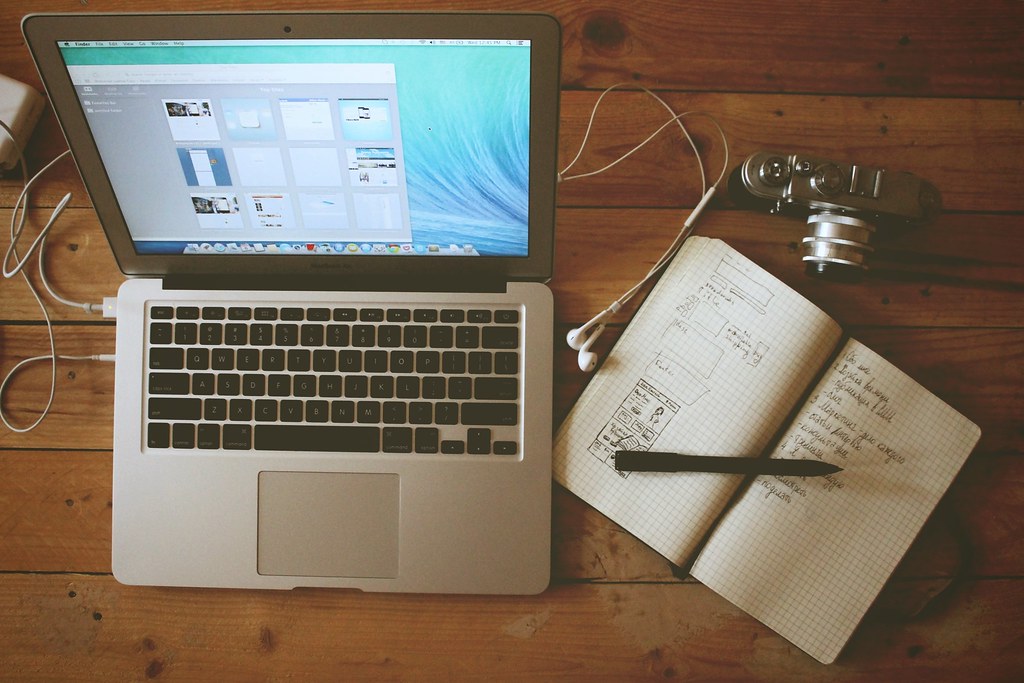 Laptop workspace representing a startup founder building a company while navigating visa options