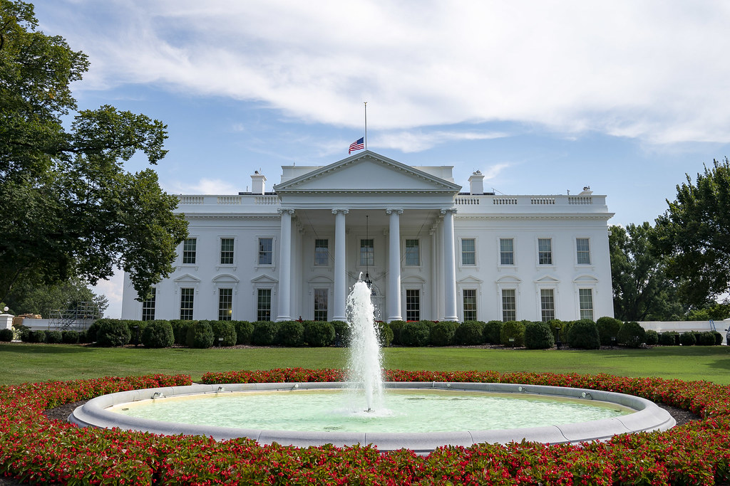 United States flag representing federal H-1B and L-1 work visa programs